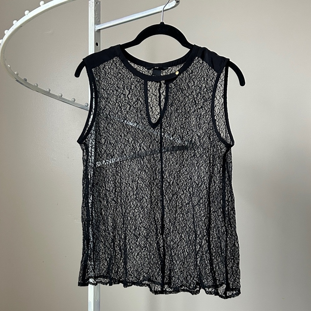 Sheer, textured black top with snap collar